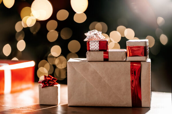gifts on the background of a christmas tree with a 2026 03 20 00 31 16 utc