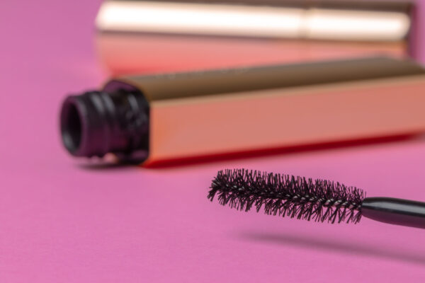 gold tube of mascara close up on pink background 2026 03 24 11 38 05 utc