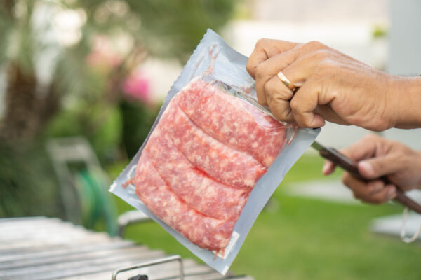 man opens a package of meat to make a barbecue 2026 01 08 06 36 32 utc