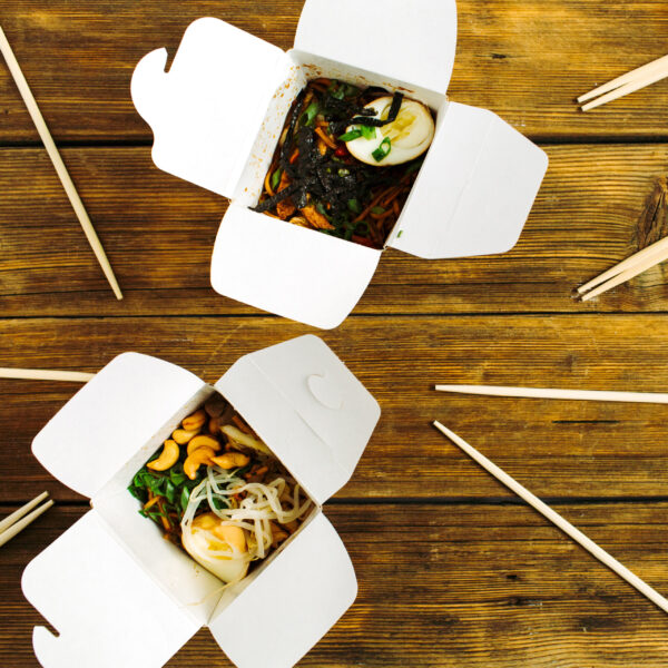 noodles in box and chopsticks on wooden table back 2026 03 26 02 32 16 utc