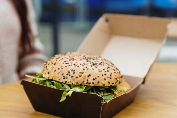one burger in a box on a table on the terrace of a 2026 03 25 10 03 29 utc