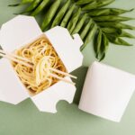 opened wok paper box with noodles and chopsticks 2026 01 08 23 43 56 utc (1)