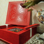 ornate red box with floral accents on table 2026 03 18 14 30 21 utc