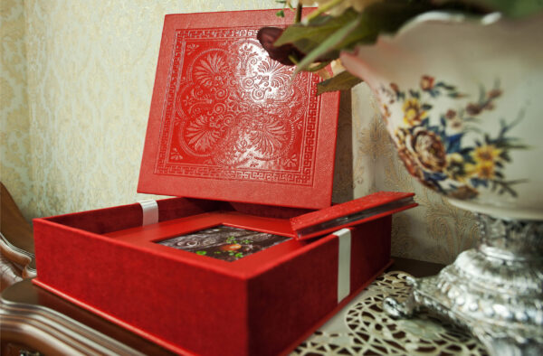 ornate red box with floral accents on table 2026 03 18 14 30 21 utc