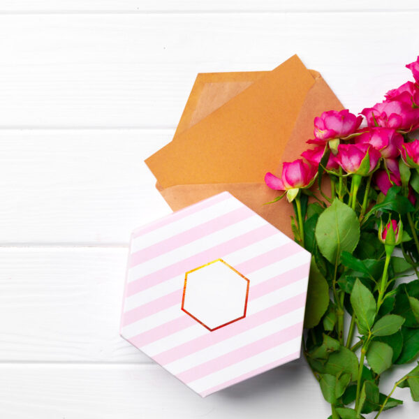 pink roses and gift box top view 2026 03 19 09 24 42 utc
