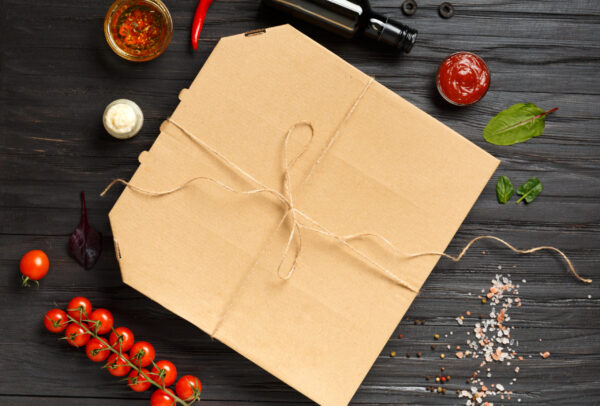 pizza in a box on a dark wooden background top vie 2026 03 09 03 24 02 utc