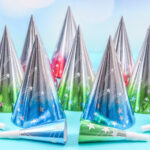 set of cone hats and birthday whistles on a blue b 2026 03 24 10 04 39 utc