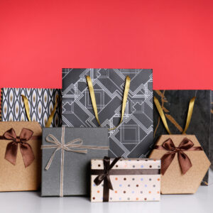 shopping paper bags and gift boxes on red backgrou 2026 03 20 04 45 48 utc