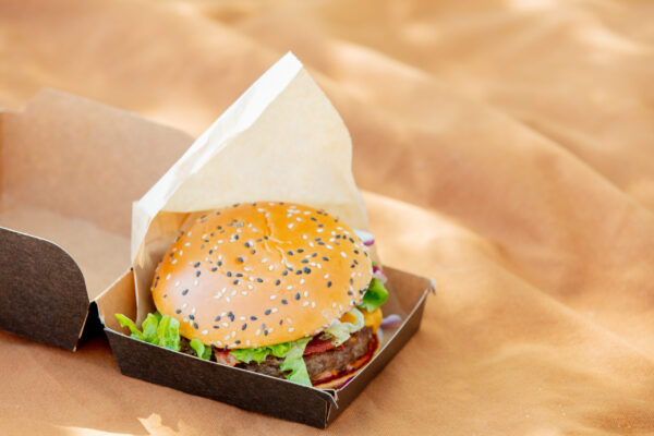 tasty burger in box on brown color cloth 2026 03 09 07 09 22 utc