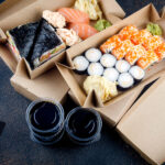 tasty sushi rolls in disposable kraft paper boxes 2026 03 23 23 51 41 utc