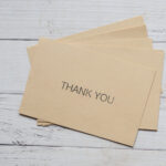 thank you message and envelope on wooden table 2026 01 07 00 03 42 utc