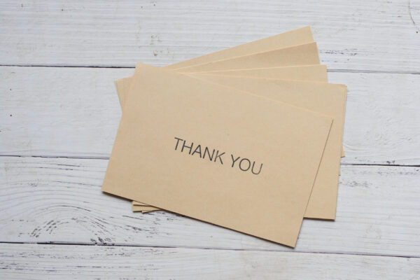 thank you message and envelope on wooden table 2026 01 07 00 03 42 utc