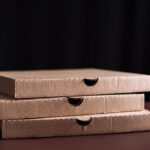 three pizza boxes stacked on top of each other 2026 03 19 03 05 08 utc