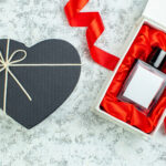 top view heart shaped box perfume bottle red ribbo 2026 03 18 13 41 32 utc