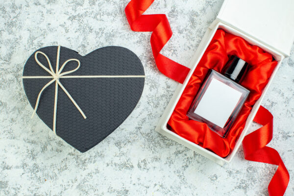 top view heart shaped box perfume bottle red ribbo 2026 03 18 13 41 32 utc
