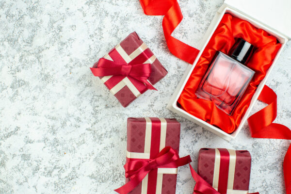 top view holiday gifts perfume bottle on grey back 2026 03 18 10 38 18 utc