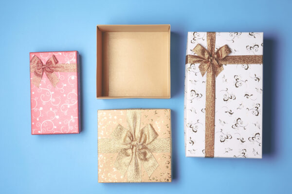 top view of open gift box and presents on blue bac 2026 03 19 02 12 12 utc