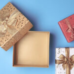 top view of open gift box and presents on blue bac 2026 03 19 05 26 11 utc