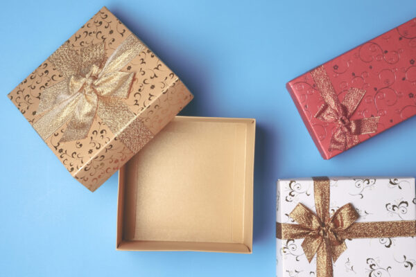 top view of open gift box and presents on blue bac 2026 03 19 05 26 11 utc
