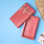 top view of open red gift box and presents on blue 2026 03 24 11 32 06 utc