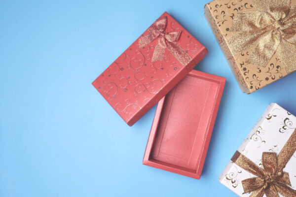 top view of open red gift box and presents on blue 2026 03 24 11 32 06 utc