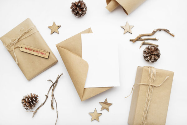 top view of wrapped gifts pine cones and merry c 2026 03 18 07 58 06 utc