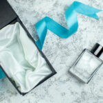 top view perfume bottle blue ribbon perfume box on 2026 03 18 09 56 45 utc