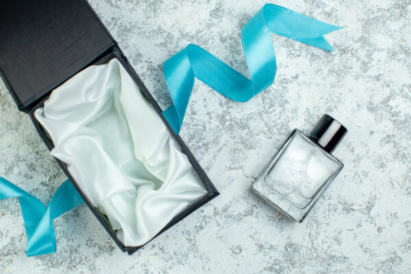 top view perfume bottle blue ribbon perfume box on 2026 03 18 09 56 45 utc