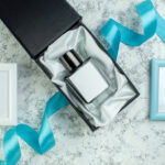 top view perfume bottle in perfume box blue and wh 2026 03 18 12 13 21 utc