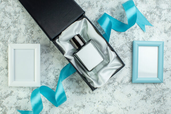 top view perfume bottle in perfume box blue and wh 2026 03 18 12 13 21 utc
