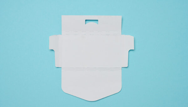 unfolded white cardboard box on a blue background 2026 03 24 14 21 39 utc