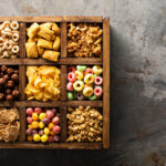variety of cold cereals in a wooden box overhead 2026 03 24 01 20 19 utc