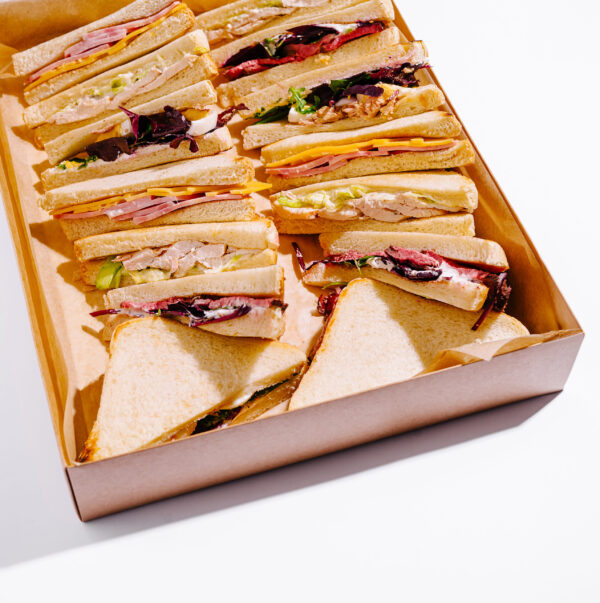 various sandwiches arranged in a takeout box for a 2026 03 24 05 09 09 utc