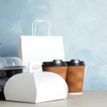 various takeout containers on table space for tex 2026 03 08 23 01 35 utc