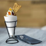 white plate with ice cream dessert in wafer cup wi 2026 01 06 09 34 12 utc
