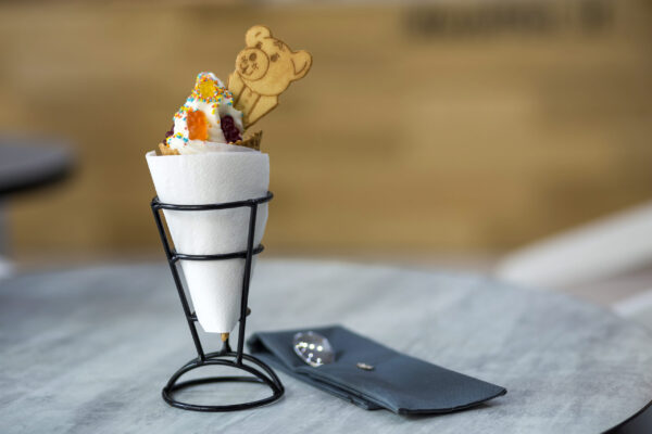 white plate with ice cream dessert in wafer cup wi 2026 01 06 09 34 12 utc