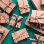 wrapped presents with bows background on teal surf 2026 03 20 06 14 36 utc