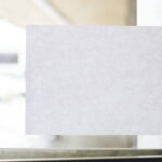 abstract white sheet affixed to doorway window 2026 03 18 11 53 13 utc
