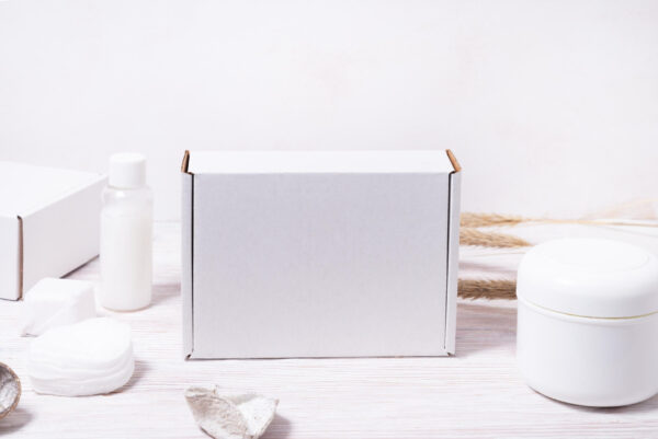 assortment of white cosmetic containers on wooden 2026 03 24 07 45 53 utc