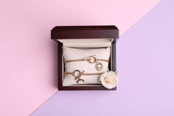 beautiful jewelry and flower in box on color backg 2026 03 27 01 46 25 utc (1)