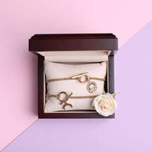 beautiful jewelry and flower in box on color backg 2026 03 27 01 46 25 utc