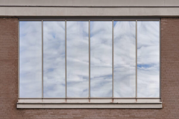 brick building facade featuring reflections of clo 2026 03 16 22 54 38 utc