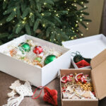 christmas ornaments in boxes with tree lights 2026 03 26 23 27 49 utc