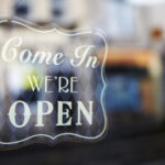 come in we re open sign on store window 2026 01 09 08 42 01 utc