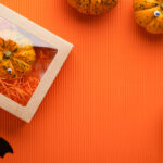 decorative pumpkins in box with bat on orange 2026 01 09 07 40 59 utc