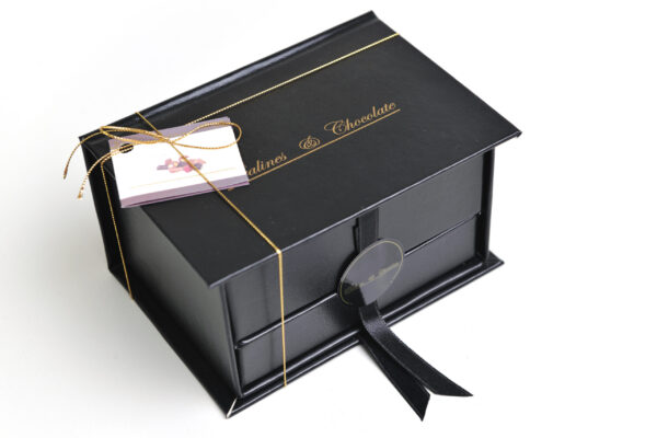 elegant black box of chocolate on white surface 2026 01 07 05 21 22 utc