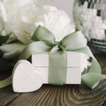 elegant gift with ribbon and flowers on table 2026 03 19 21 56 54 utc