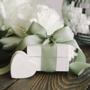 elegant gift with ribbon and flowers on table 2026 03 19 21 56 54 utc