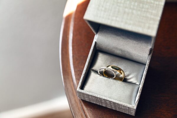 elegant gold wedding rings in a gray box 2026 03 18 17 38 12 utc