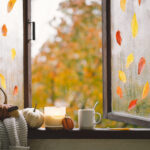 fall window with pumpkins and candle 2026 01 09 01 10 22 utc